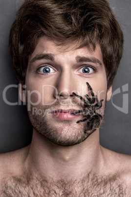 Portrait of a Young Handsome Man with Spider on His Face