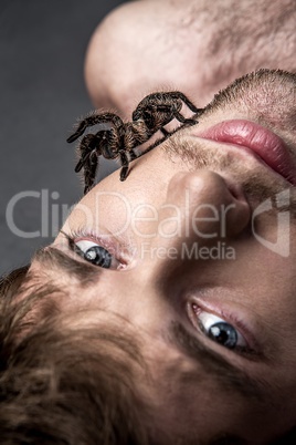 Portrait of a Young Handsome Man with Spider on His Face