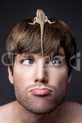 Portrait of a Young Handsome Man with Lizard on His Face