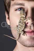 Portrait of a Young Handsome Man with Lizard on His Face