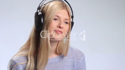 Attractive girl listening to music with headphones