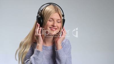 Pretty hipster girl going crazy of favorite music