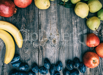 Fresh ripe fruits , empty space in the middle, top view