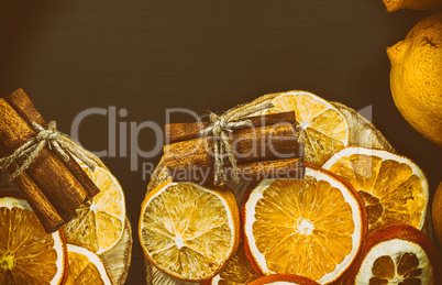 Slices of orange and lemon on a wooden stump