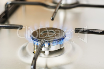 burning gas in range burner