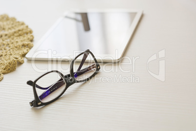 glasses and tablet