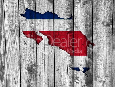 Karte und Fahne von Costa Rica auf verwittertem Holz Karte und Fahne von Costa Rica auf verwittertem Holz