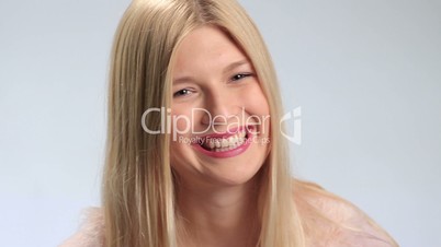Attractive young woman smiling to the camera