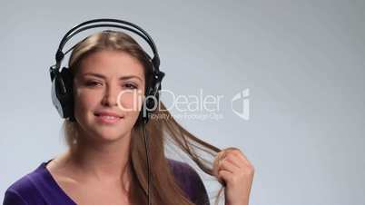 Cute girl relaxing listening music with headphones