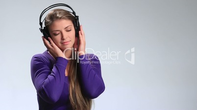 Woman wearing headphones listening to music