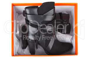 Black ankle boots in a box