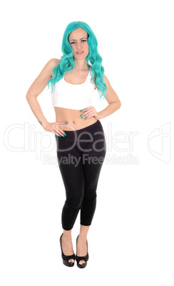 Woman standing with blue hair and tights.
