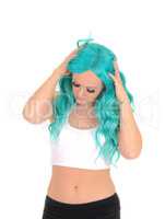 Woman messing with her blue hair.
