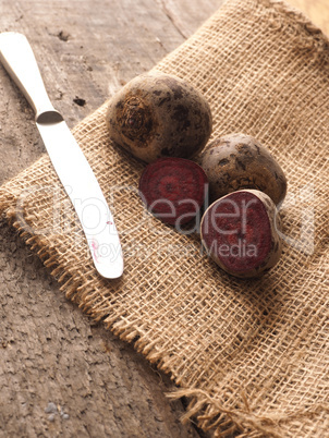 Organic beet root on rustic background