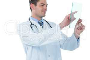 Male doctor using an futuristic digital tablet