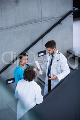 Doctors and nurse having a discussion on stairs