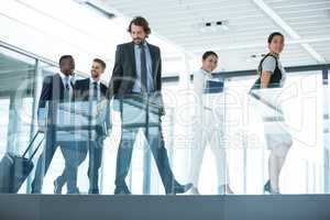 Businesspeople walking in office