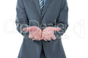 Businessman pretending to hold an object