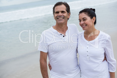 Romantic couple standing on beach