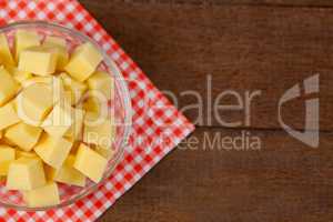 Cheese cubes in bowl on cloth napkin