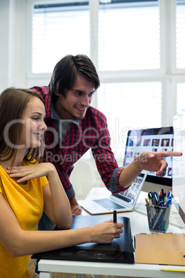 Graphic designers working at desk