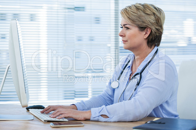 Female doctor working on computer