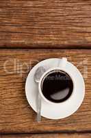 Cup of coffee on wooden table