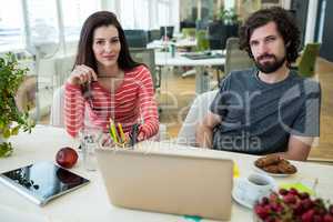 Graphic designers working at desk