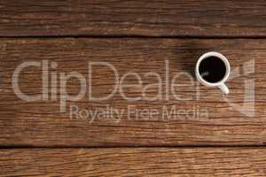 Cup of coffee on wooden table