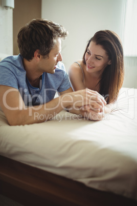 Romantic couple relaxing on bed