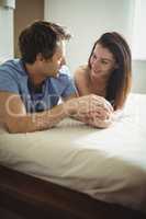 Romantic couple relaxing on bed