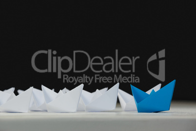 Paper boats arranged together