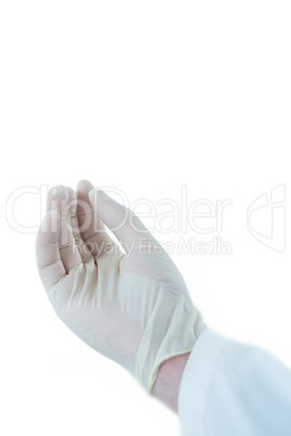 Male doctor gesturing against white background