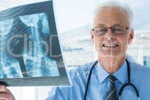 Portrait of doctor analyzing x-ray report