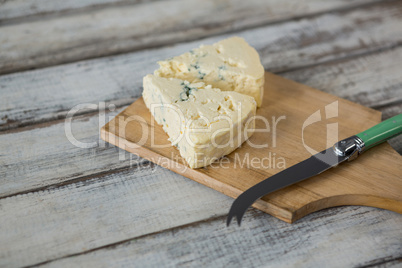 Slices of cheese with knife