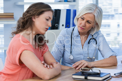 Doctor consoling patient