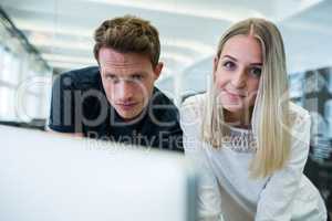 Graphic designers working at desk