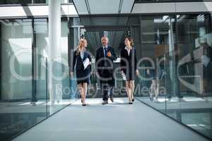 Businesspeople walking in the office