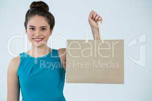 Beautiful woman holding shopping bag