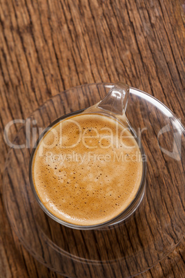 Cup of coffee on wooden table