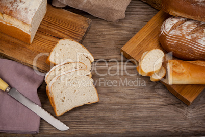 Various bread loaves with slices