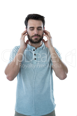 Handsome man listening to headphones