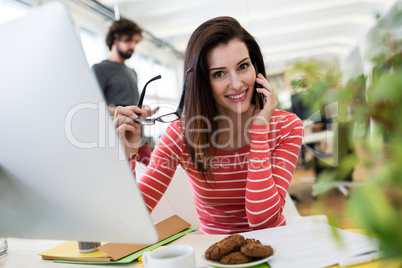 Female graphic designer sitting at desk