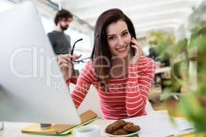 Female graphic designer sitting at desk