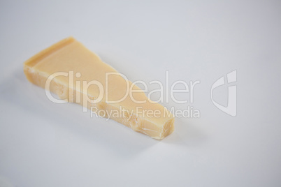 Piece of cheese on white background