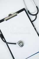 Close-up of stethoscope and clipboard