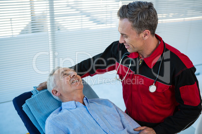 Paramedic interacting with patient