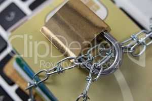 Smart cards locked in chain on laptop