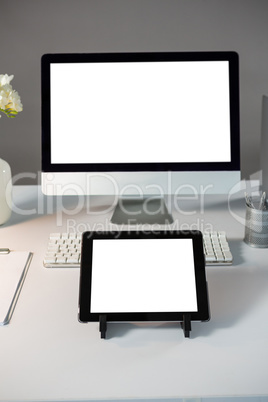 Desktop pc with digital tablet on table
