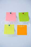 Multicolored adhesive note on white background